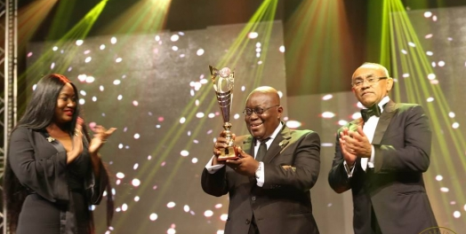 President Akufo-Addo (middle) receiving an award at the 2017 CAF awards in Accra